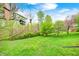 Large backyard with mature trees, lawn and gardens in spring at 8329 S Christian Dr, Nineveh, IN 46164
