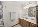 Traditional bathroom features wood cabinets, double sinks, and tile floor at 8329 S Christian Dr, Nineveh, IN 46164