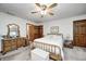 Carpeted bedroom features a queen bed, wooden furniture and two closets at 8329 S Christian Dr, Nineveh, IN 46164