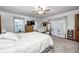 Carpeted main bedroom features French doors, two windows and neutral paint at 8329 S Christian Dr, Nineveh, IN 46164