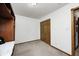 Spare bedroom featuring a double door closet and neutral carpet and wall tones at 8329 S Christian Dr, Nineveh, IN 46164
