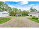 Ranch style home with two outbuildings, stone driveway, and a landscaped yard offering a welcoming curb appeal at 8329 S Christian Dr, Nineveh, IN 46164