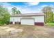 Detached garage with metal roof, white siding, and large doors at 8329 S Christian Dr, Nineveh, IN 46164