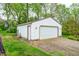 Exterior view of detached garage with gravel driveway and green lawn at 8329 S Christian Dr, Nineveh, IN 46164