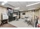 Finished garage interior with wood paneling, work area, and storage cabinets at 8329 S Christian Dr, Nineveh, IN 46164