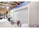Garage interior featuring large door, overhead lighting, and storage at 8329 S Christian Dr, Nineveh, IN 46164