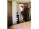 A bedroom features a closet and a view into the dining room at 9067 Old Haggard Rd, Morgantown, IN 46160