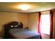 Cozy bedroom featuring a comfortable bed and a bright window at 9067 Old Haggard Rd, Morgantown, IN 46160