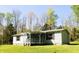 Inviting home featuring a covered porch and well-maintained lawn at 9067 Old Haggard Rd, Morgantown, IN 46160