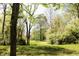 Home with well-kept yard and mature trees, creating a serene outdoor space at 9067 Old Haggard Rd, Morgantown, IN 46160