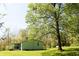 This cozy home features a covered porch and is surrounded by mature trees at 9067 Old Haggard Rd, Morgantown, IN 46160
