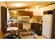 A kitchen with cabinets, counter space, a refrigerator, and a stove with an overhead vent at 9067 Old Haggard Rd, Morgantown, IN 46160
