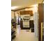 A well-lit kitchen with appliances, cabinets, and ample counter space for cooking and storage at 9067 Old Haggard Rd, Morgantown, IN 46160