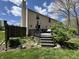 View of a two-story home featuring a wooden deck with stairs leading to a well-maintained backyard at 9415 Timber View Dr, Indianapolis, IN 46250