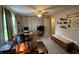 Bright bedroom with a ceiling fan, ample storage, and a well-lit workspace at 9415 Timber View Dr, Indianapolis, IN 46250