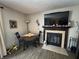 Cozy dining area with a fireplace and television creates a comfortable and inviting space at 9415 Timber View Dr, Indianapolis, IN 46250