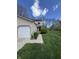 Charming home with a manicured lawn, walkway, and a bright, inviting exterior under a sunny sky at 9415 Timber View Dr, Indianapolis, IN 46250