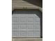 Close-up of a white garage door featuring raised panels and the house number above at 9415 Timber View Dr, Indianapolis, IN 46250