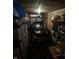 A car parked inside an organized garage with storage shelves and overhead lighting at 9415 Timber View Dr, Indianapolis, IN 46250