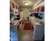 Functional kitchen featuring red and white cabinets, appliances, and a cozy layout at 9415 Timber View Dr, Indianapolis, IN 46250