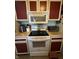 Stove top and oven area of kitchen featuring modern appliances and ample countertop space at 9415 Timber View Dr, Indianapolis, IN 46250