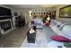 Spacious living room with a fireplace, couches, and an open view into the dining and kitchen areas at 9415 Timber View Dr, Indianapolis, IN 46250