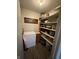 Organized pantry with shelving, freezer and ample storage space for food and kitchen essentials at 9415 Timber View Dr, Indianapolis, IN 46250