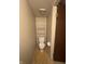 Small bathroom with a toilet and a storage shelf above it at 9415 Timber View Dr, Indianapolis, IN 46250