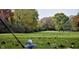Scenic view of a golf course fairway with lush green grass, mature trees, and a visible hole in the distance at 953 Udell St, Indianapolis, IN 46208