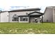 Large backyard with covered patio, ideal for entertaining or relaxation, perfectly complements the home's exterior at 9920 Deep Royal Way, Indianapolis, IN 46239