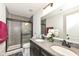Nicely appointed bathroom with a double sink vanity, large mirror, and a shower tub combo at 9920 Deep Royal Way, Indianapolis, IN 46239