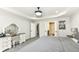 Bedroom showcasing a vanity area, open doorway to a bathroom, and natural light at 9920 Deep Royal Way, Indianapolis, IN 46239