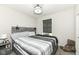 Cozy bedroom with a gray upholstered headboard, bedside table, and a plush teddy bear at 9920 Deep Royal Way, Indianapolis, IN 46239