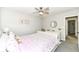 Bedroom with a ceiling fan, neutral paint, and a large decorative headboard at 9920 Deep Royal Way, Indianapolis, IN 46239
