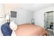 Well-lit bedroom features a plush bed, modern shades, and an open closet at 9920 Deep Royal Way, Indianapolis, IN 46239