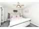 Comfortable bedroom with neutral paint, ceiling fan, and a large decorative headboard at 9920 Deep Royal Way, Indianapolis, IN 46239