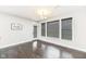 Bright dining room with modern chandelier and large windows with dark blinds at 9920 Deep Royal Way, Indianapolis, IN 46239