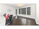 Dining area featuring dark hardwood floors, modern lighting, and large windows at 9920 Deep Royal Way, Indianapolis, IN 46239