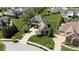 Stunning aerial view of a well-manicured property featuring lush green lawns and mature trees in a suburban neighborhood at 10138 Backstretch Row, Fishers, IN 46040