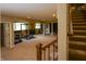 Finished basement featuring plush carpet, stair access, and windows providing plenty of natural light at 10138 Backstretch Row, Fishers, IN 46040