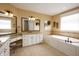 Large primary bath featuring a soaking tub, double vanity, and tile floors at 10138 Backstretch Row, Fishers, IN 46040