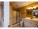 Bathroom with shower featuring frameless glass and vanity with plenty of counter space at 10138 Backstretch Row, Fishers, IN 46040