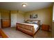Cozy bedroom with a wooden bed frame, side tables, dresser, and serene decor, creating a comfortable retreat at 10138 Backstretch Row, Fishers, IN 46040