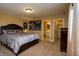 Neutral bedroom showcasing en suite bathroom at 10138 Backstretch Row, Fishers, IN 46040