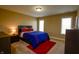 Cozy bedroom with neutral walls, plush carpet, and a bright window at 10138 Backstretch Row, Fishers, IN 46040