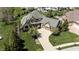 Stunning exterior elevation of home with manicured landscaping and curved driveway leading to the two-car garage at 10138 Backstretch Row, Fishers, IN 46040