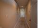 Narrow hallway with access to rooms at 10138 Backstretch Row, Fishers, IN 46040