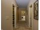 Hallway showing closet and bathroom access at 10138 Backstretch Row, Fishers, IN 46040