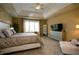 Spacious main bedroom featuring a tray ceiling, large window, and ample natural light at 10138 Backstretch Row, Fishers, IN 46040