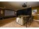 Spacious theater room with large screen, projector, and comfortable seating for the ultimate entertainment experience at 10138 Backstretch Row, Fishers, IN 46040